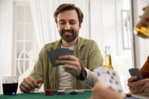 close-up-person-playing-poker-with-friends-scaled.jpg